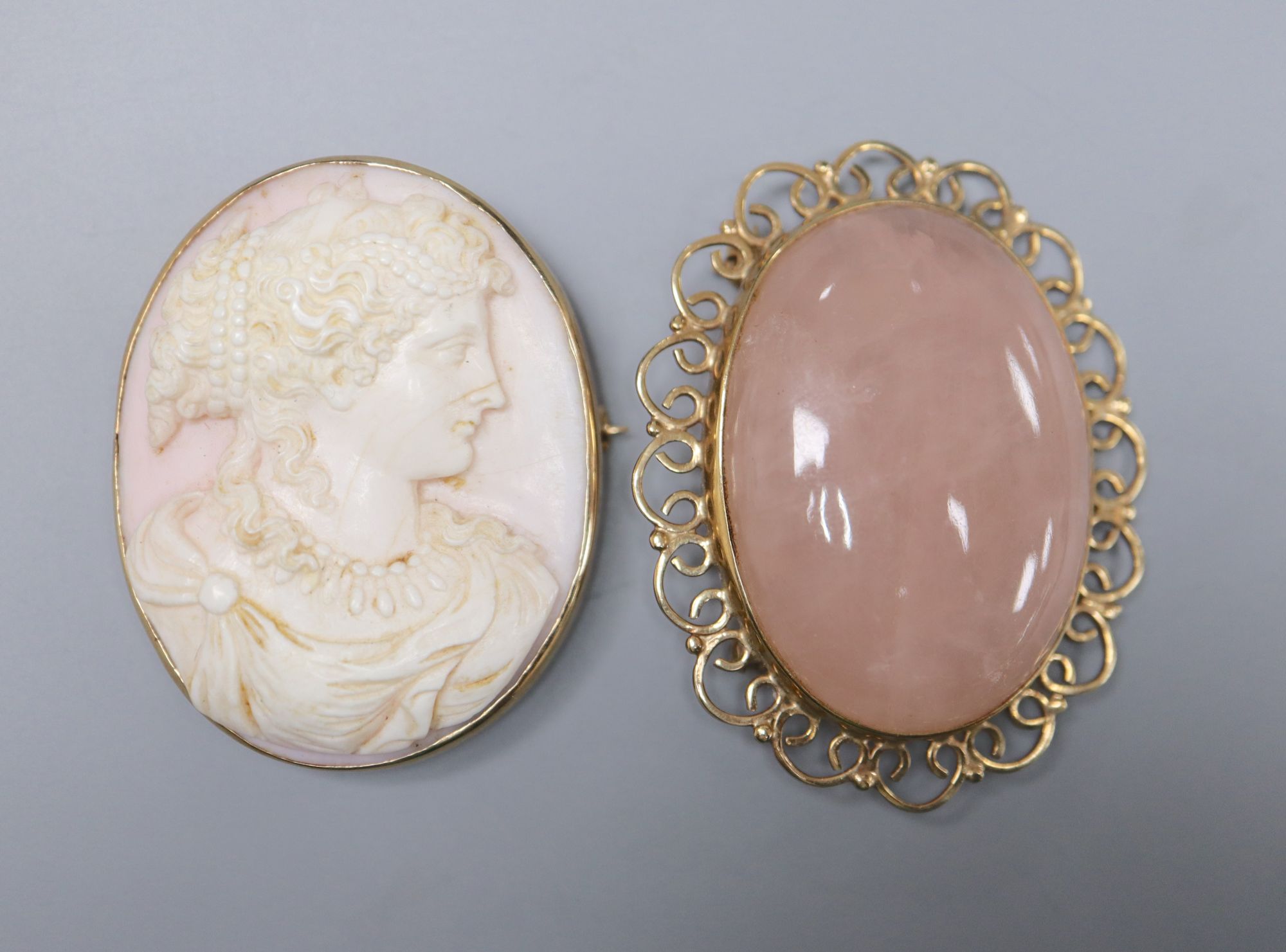 A 9ct gold-framed carved shell cameo portrait brooch and a 9ct gold-framed rose quartz brooch, 46mm, gross 34 grams.